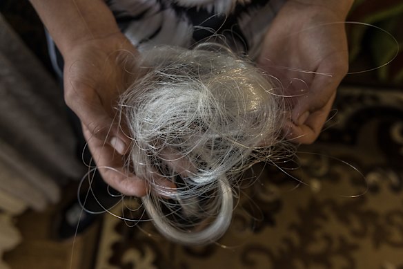 Anatolii holds the fibre-optic cable he saved from the Russian FPV drone that he disabled.