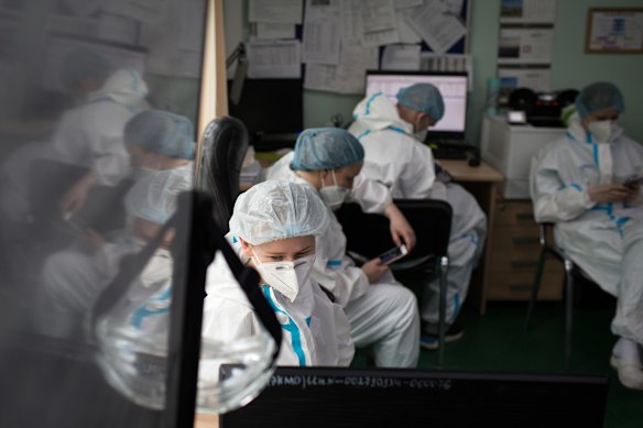 Doctors prepare for their morning rounds in Russia.