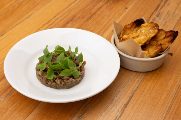 “The beef is beefier here and the Dutch creams are creamier”: Beef tartare with smoked schmaltz and salsa verde 
served with fried Dutch Cream potatoes.