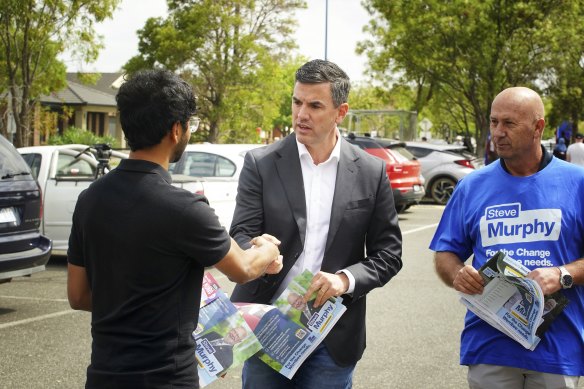 Opposition Leader Brad Battin handing out how-to-vote cards at Manor Lakes Primary School.