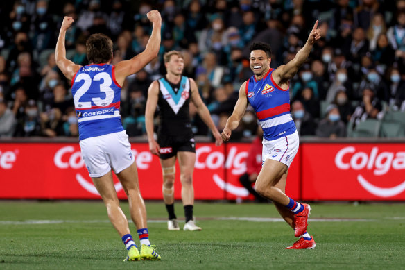 Laitham Vandermeer and Jason Johannisen of the Bulldogs celebrate after a goal.