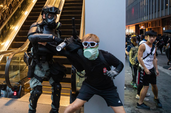 Riot police clash with protesters in Hong Kong, where residents are campaigning to preserve and expand freedoms unique to the territory within China.