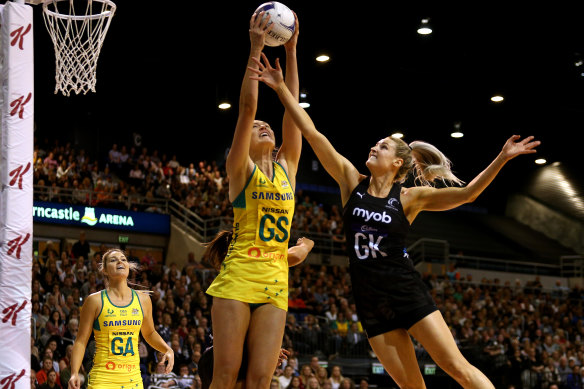 Australia's Caitlin Bassett and the Silver Ferns' Jane Watson have eyes only for the ball during the hard-fought clash. Bassett later left the court and was replaced by Caitlin Thwaites.
