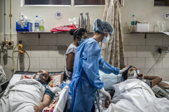 Medical staff attend to a COVID-19 patient in New Delhi. 