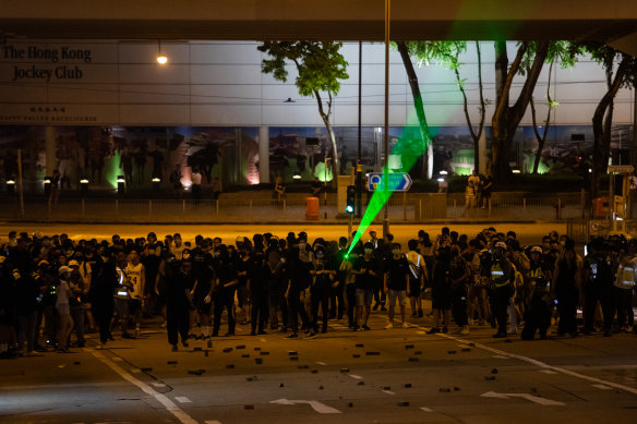 Protests raged outside the stadium that housed Carrie Lam's community dialogue event.