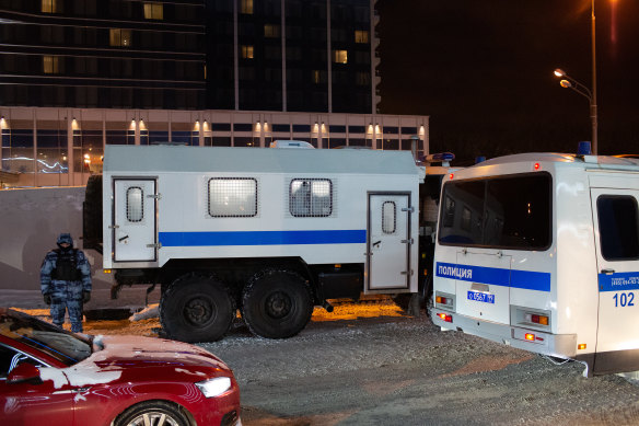 Polices buses await the arrival of Navalny at Vnukovo International airport in Moscow.