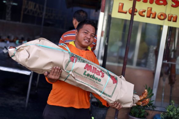 The Manila neighbourhood of La Loma is full of grill shops that specialise in lechon, or roast pig, one of the favourite dishes in the Philippines.