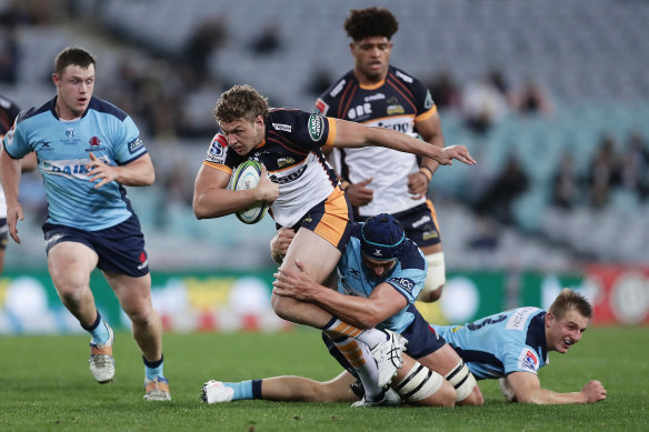Bayley Kuenzle is tackled at ANZ Stadium.