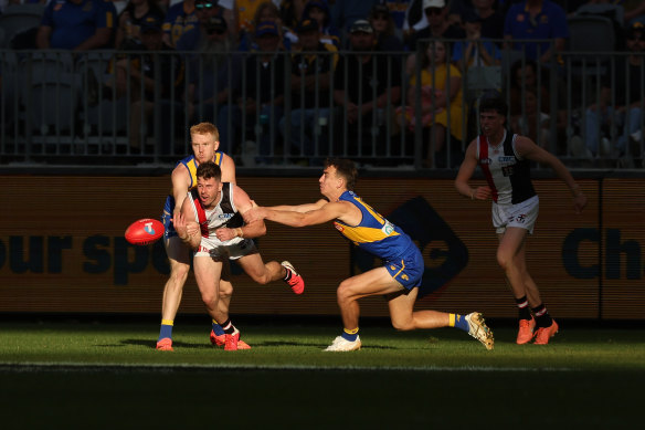 Jack Higgins from the Saints battles for the ball.