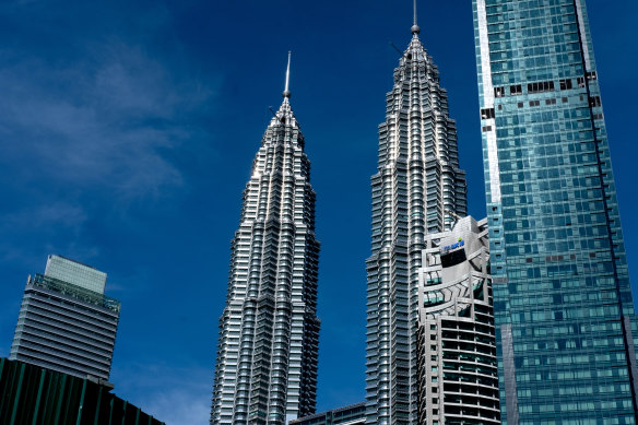The crash happened in a tunnel about 100 metres away from the KLCC station outside the Petronas Twin Towers, pictured.