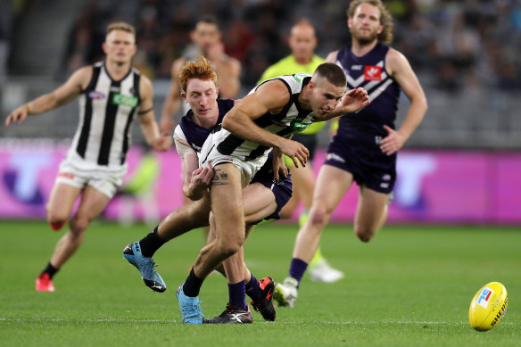 Brayden Sier, pictured being tackled in round nine against the Dockers, was injured in the clash against the Crows.  