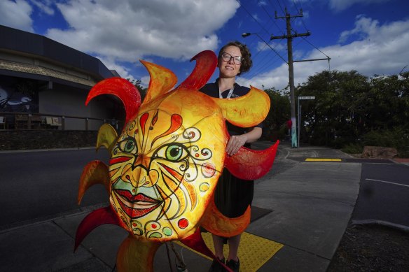 Belgrave Library team leader Toni Main holding Mr Radiance. 