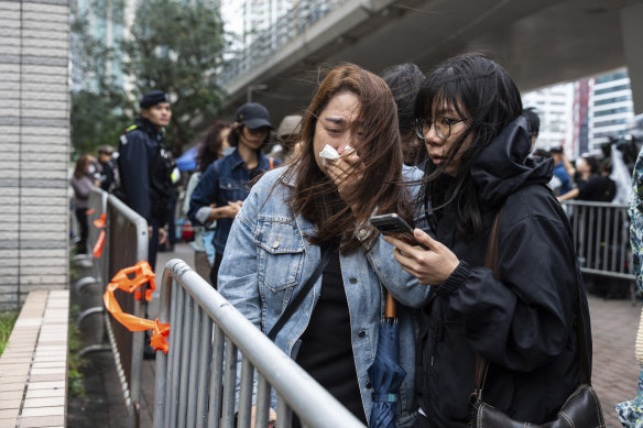 People leave the West Kowloon Magistrates’ Courts after the sentencing.
