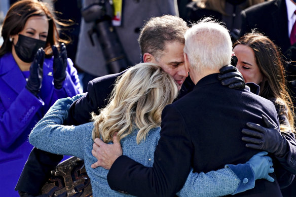  Vice-President Kamala Harris applauds as President Joe Biden is embraced by his son Hunter, First Lady Jill Biden and daughter Ashley: 'We will get through this. Together'. 