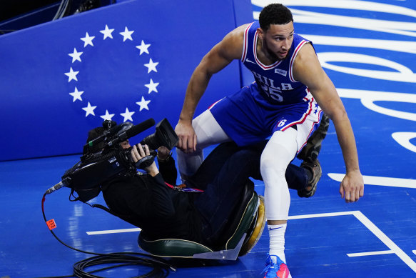 The 76ers’ Ben Simmons collides with a cameraman during Philadelphia’s game five win over the Wizards.