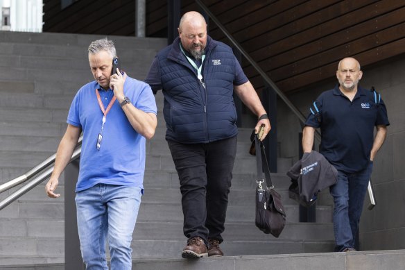 Workers leave the Porter Davis’ office in Melbourne on Friday morning.