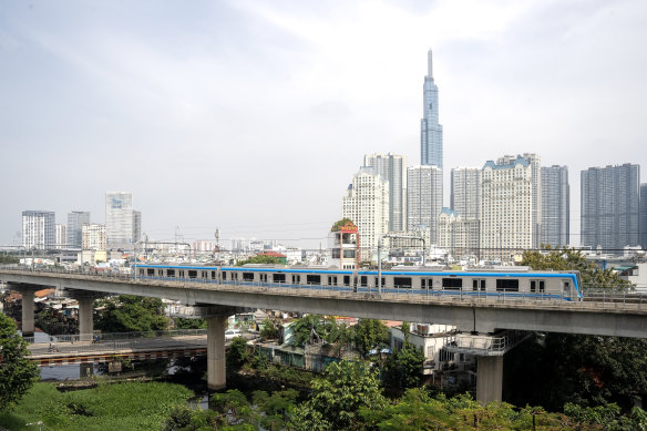 A metro train passes through the city during the launch of the first metro line in Ho Chi Minh City, Vietnam.