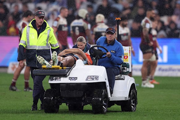 Joseph-Aukuso Suaalii is taken off the field during the Waratahs’ clash with the Reds.