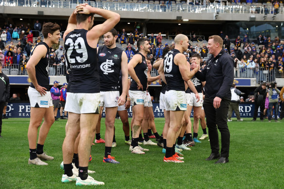 Michael Voss with his players after their win against West Coast in round 23.