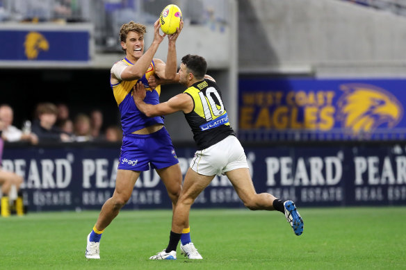 Greg Clark and Shane Edwards battle for the ball.