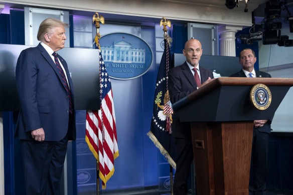 Stephen Hahn, commissioner of food and drugs at the US Food and Drug Administration (FDA), centre, speaks during a news conference at the White House as President Trump and Human Services Secretary Alex Azar look on. 