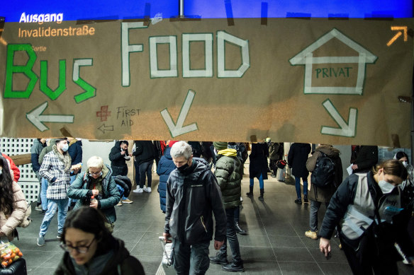 A sign advices directions for people fleeing war-torn Ukraine after the arrived on a train from Poland at the Hauptbahnhof main railway station on March 6, 2022 in Berlin, Germany.