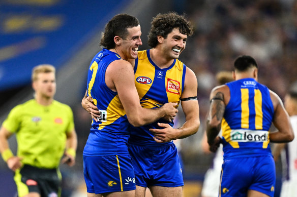 West Coast pair Tom Barrass and Jake Waterman celebrate a goal.