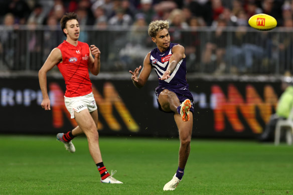 Liam Henry snaps for the Dockers, who beat Essendon comfortably in the end.