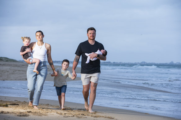 Matt Sinden and Whitney Tucker with their children Atlas, Kenzie and baby Scottie.