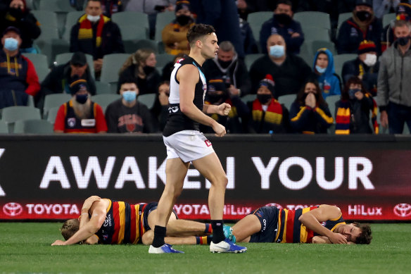 Nick Murray and Will Hamill of the Crows collide during the clash with the Power.