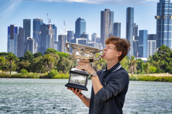 Jannik Sinner with the spoils of victory - the Norman Brookes Challenge Cup - after his win in the Australian Open.