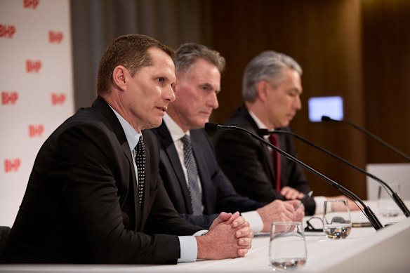 BHP’s new boss Brandon Craig (left) talks to the media with chair Ross McEwan (centre) and outgoing CEO Mike Henry.