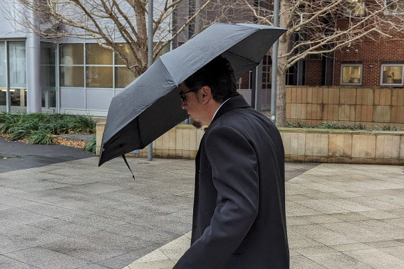 Former English teacher Vasilious Kafataris leaves Parramatta District Court on the first day of his trial.