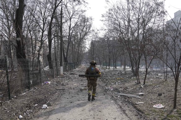 A Ukrainian serviceman in Mariupol, which has been under siege for more than a week.