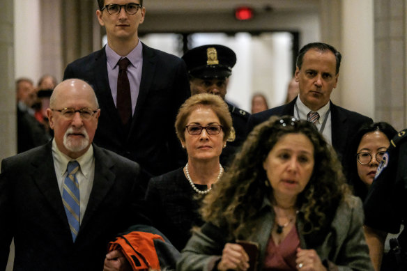 Marie Yovanovitch, the former US Ambassador to Ukraine, centre, arrives at the US Capitol in Washington DC.