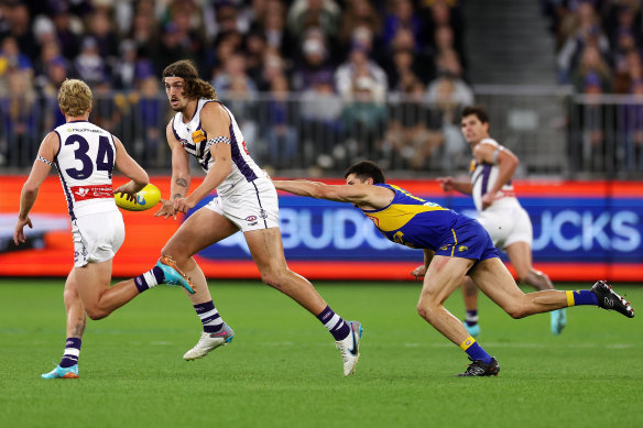 Luke Jackson of the Dockers handpasses the ball in their demolition of West Coast.