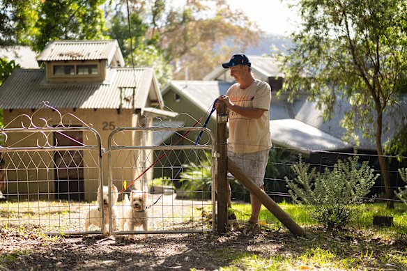 Brett South takes his dogs out for a walk on Dangar Island.