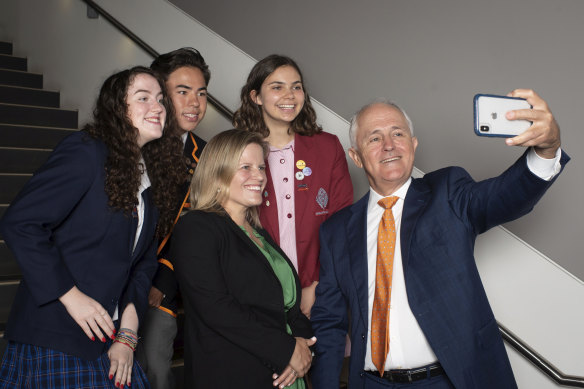 Malcolm Turnbull and his daughter Daisy Turnbull Brown with students Alice Morgan, Ethan Cheung and Eloise Aiken at Sydney University on Friday.