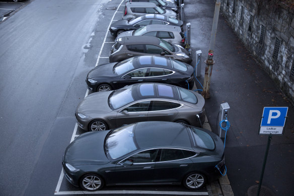 Electric vehicles charge at a station in Oslo.