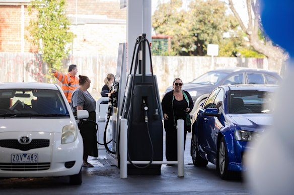 Motorists fill up at a petrol station in the northern Melbourne suburb of Preston.