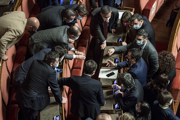 Matteo Salvini, League leader, right in blue, speaks with senators after the confidence vote.