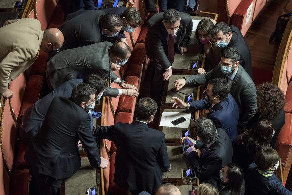 Matteo Salvini, League leader, right in blue, speaks with senators after the confidence vote.