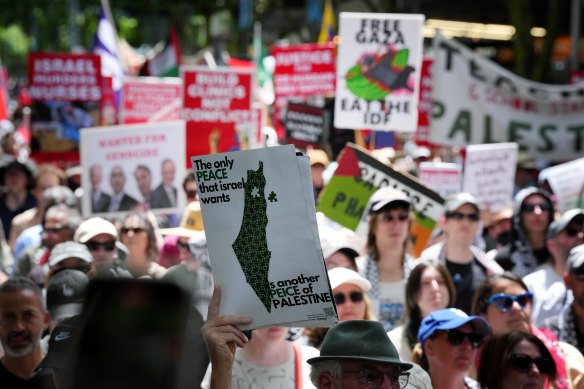 Demonstrators march towards Parliament House during the weekly pro-Palestinian rally in Melbourne on Sunday.