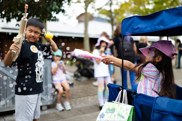 The Ngyuen family play with their new toys.
