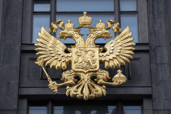 The coat of arms of the Russian Federation on the front of the State Duma building in Moscow.