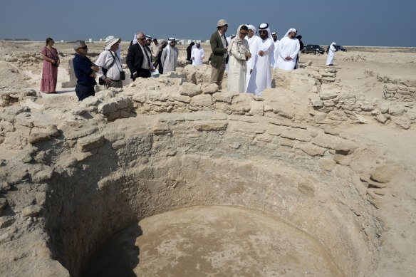 Sheikh Majid bin Saud al-Mualla, front right, and other officials at the ancient Christian monastery on Siniyah Island, United Arab Emirates.