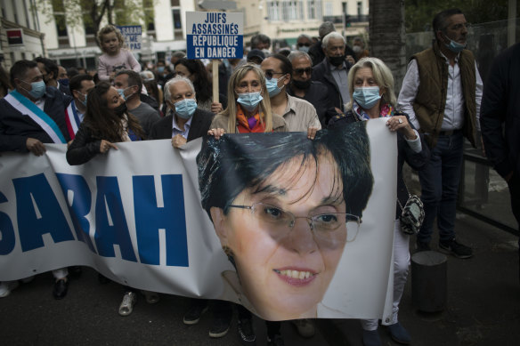 Protesters march with a banner of killed Jewish woman Sarah Halimi, during a demonstration in Marseille. 