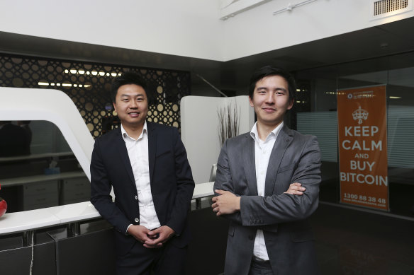 Blockchain Global’s former director, Allan Guo, and CEO Sam Lee during happier times in 2014.