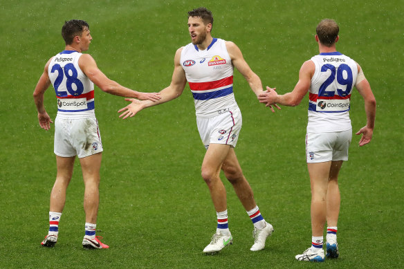 Marcus Bontempelli celebrates a goal with teammates.