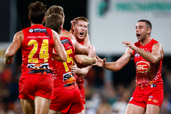 Matt Rowell celebrates a goal for Gold Coast.